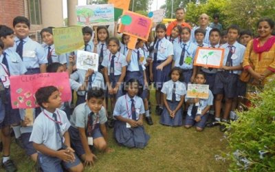 School children plant saplings at Governing Body