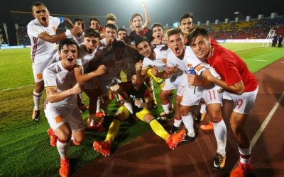 LATE PENALTY SENDS SPAIN THROUGH